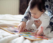 Mom reading to baby