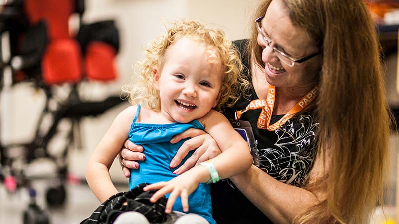 Daughter and caregiver talking