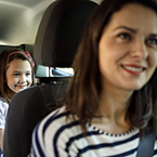 child and parent in car