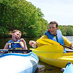 child and parent in boat